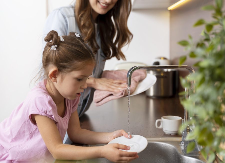 close-up-little-girl-helping-her-mom-with-dishes